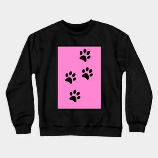 Black Paw-prints on a Pink surface Crewneck Sweatshirt